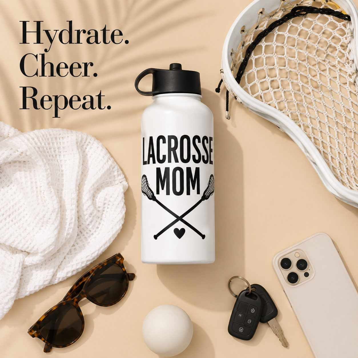 All the lacrosse mom essentials for lacrosse stick ball phone keys towel and sunglasses